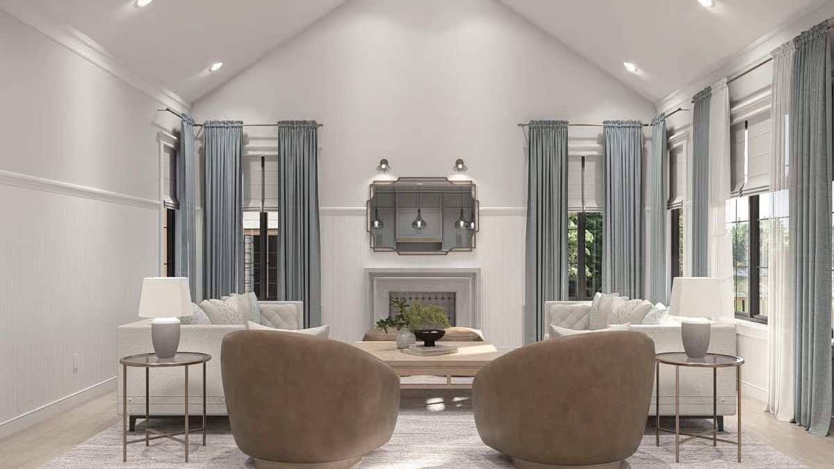 Vaulted Ceilings and Caramel Swivel Chairs Anchor This Living Room