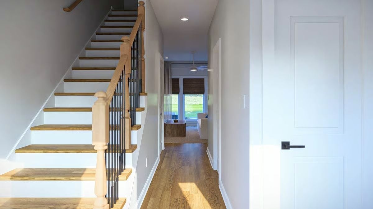 Oak Treads, Black Spindles, and a Hallway That Pulls You Toward the Light