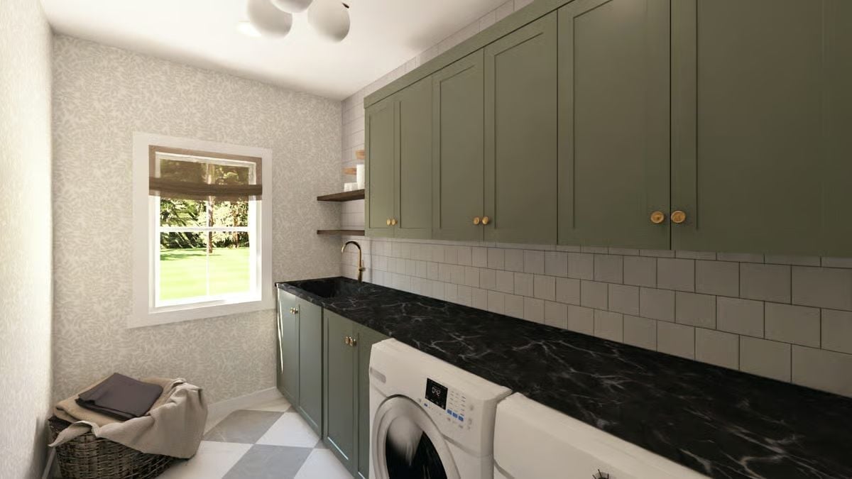 Sage Cabinets and Black Marble Counters in a Laundry Room That Pulls Its Weight