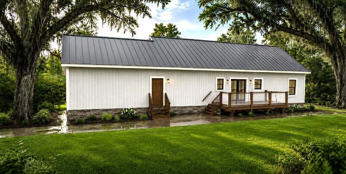 White Board-and-Batten, a Metal Roof, and Mature Oaks That Earned Their Place