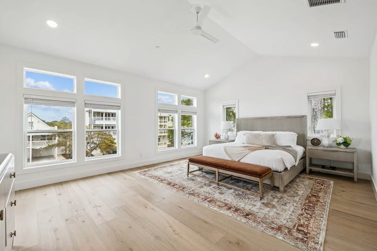Light Wood Floors and Layered Windows Pull Morning Sun Deep Into the Room