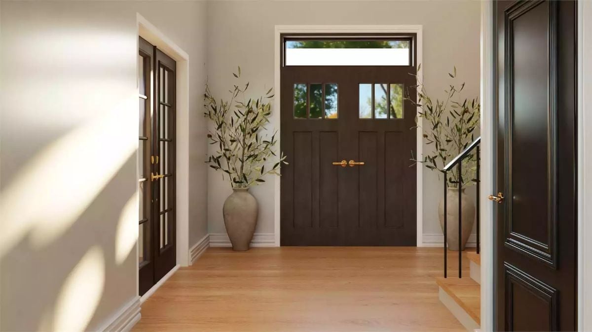 Dark Doors and Brass Hardware Set the Tone Before You're Even Inside