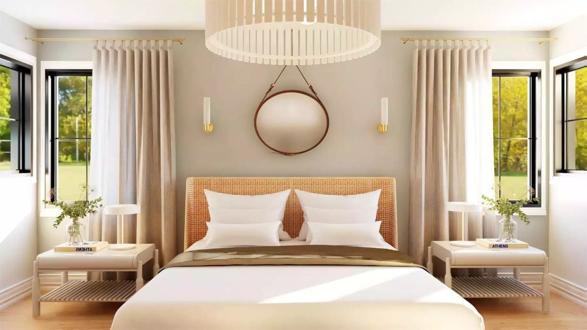 Rattan Headboard and Round Mirror Give This Bedroom Real Backbone
