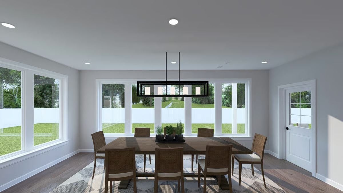 Rattan Chairs, a Linear Pendant, and Windows That Do the Heavy Lifting