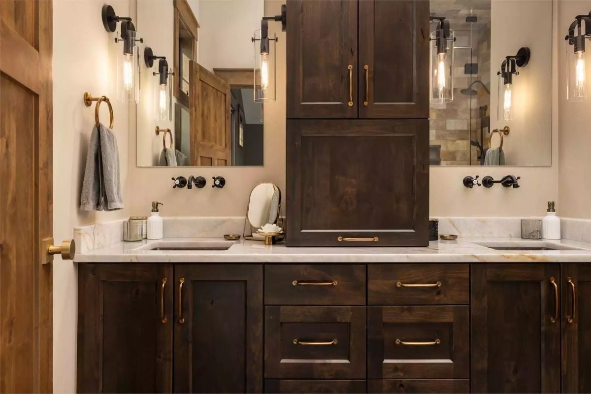 Brass Pulls, Wall-Mount Faucets, and Cabinetry Dark Enough to Mean It