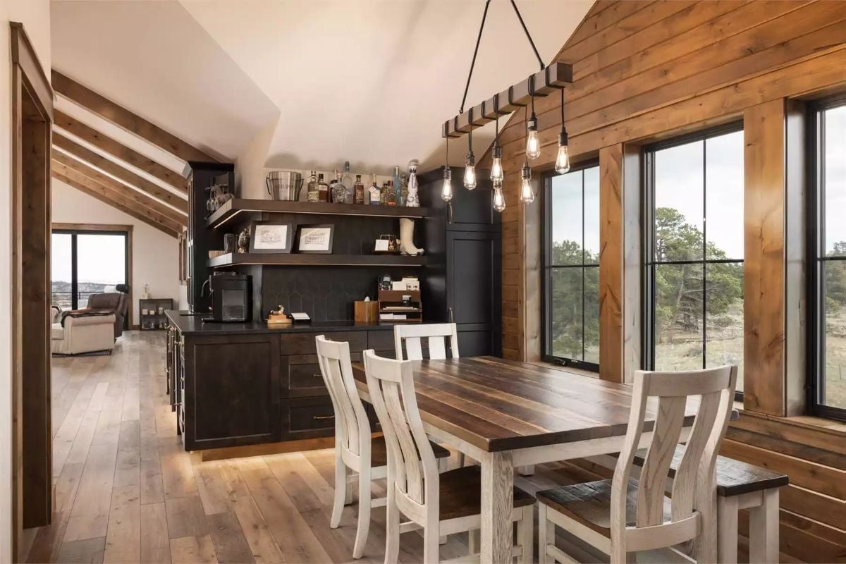 Edison Bulbs, Dark Cabinetry, and a Table Built to Last Decades