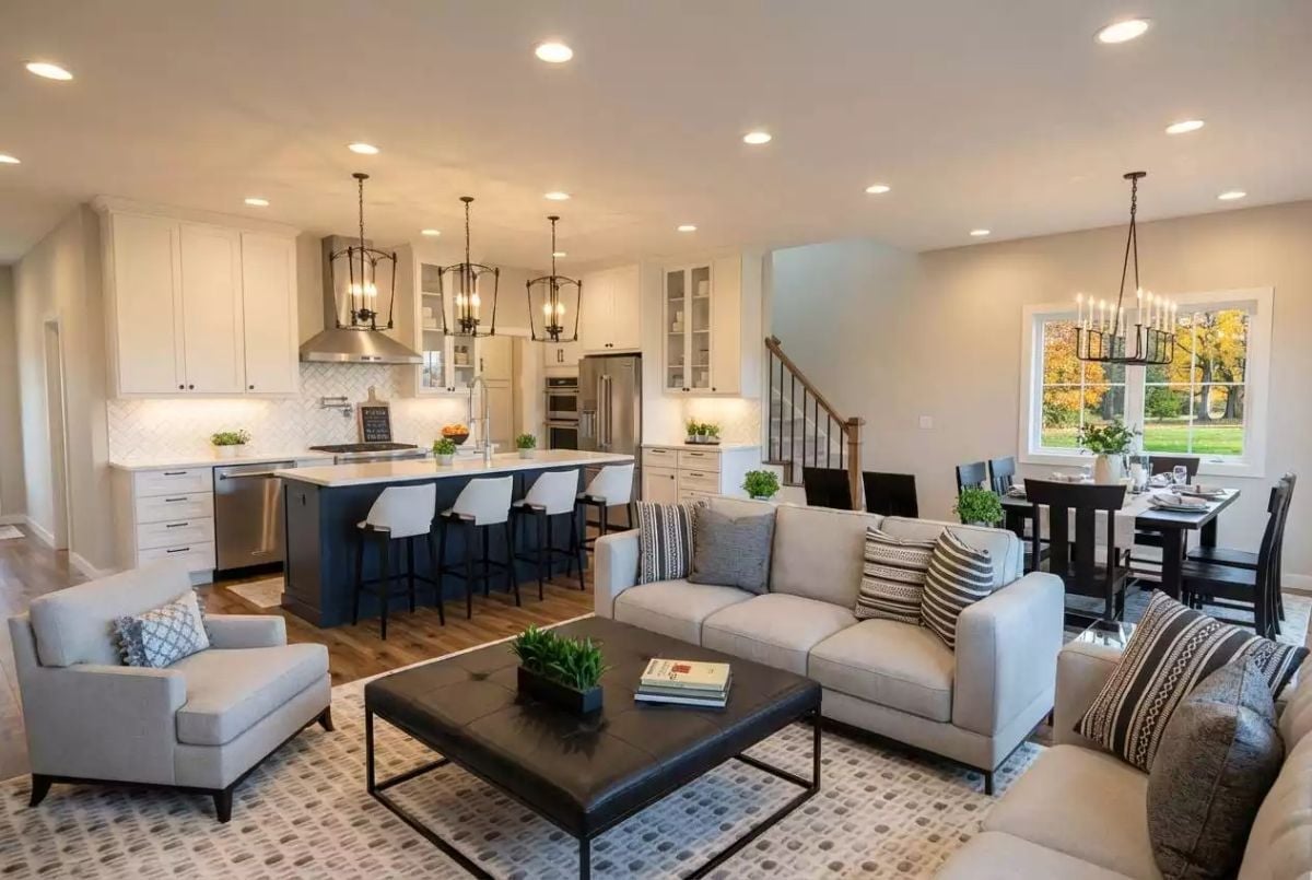 Navy Island, White Cabinets, and Three Pendant Lights That Anchor Everything