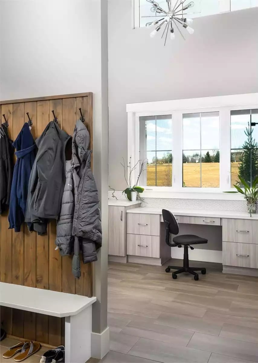 Coat Hooks on Shiplap Planks, Built-In Desk, and a Prairie View That Does the Work
