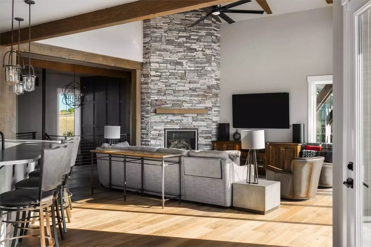 Floor-to-Ceiling Stacked Stone and a Sectional That Earns Its Square Footage