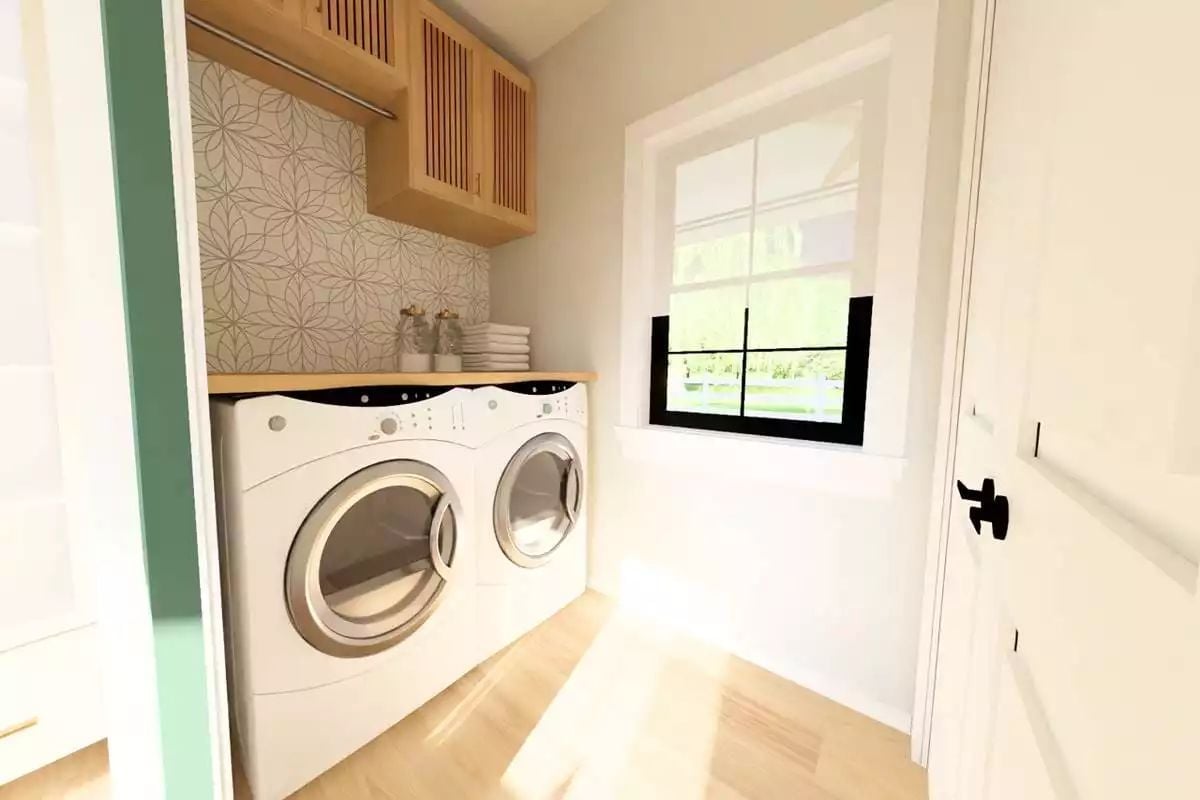 Butcher Block Countertop and a Hanging Rod Make Laundry Feel Less Like a Chore