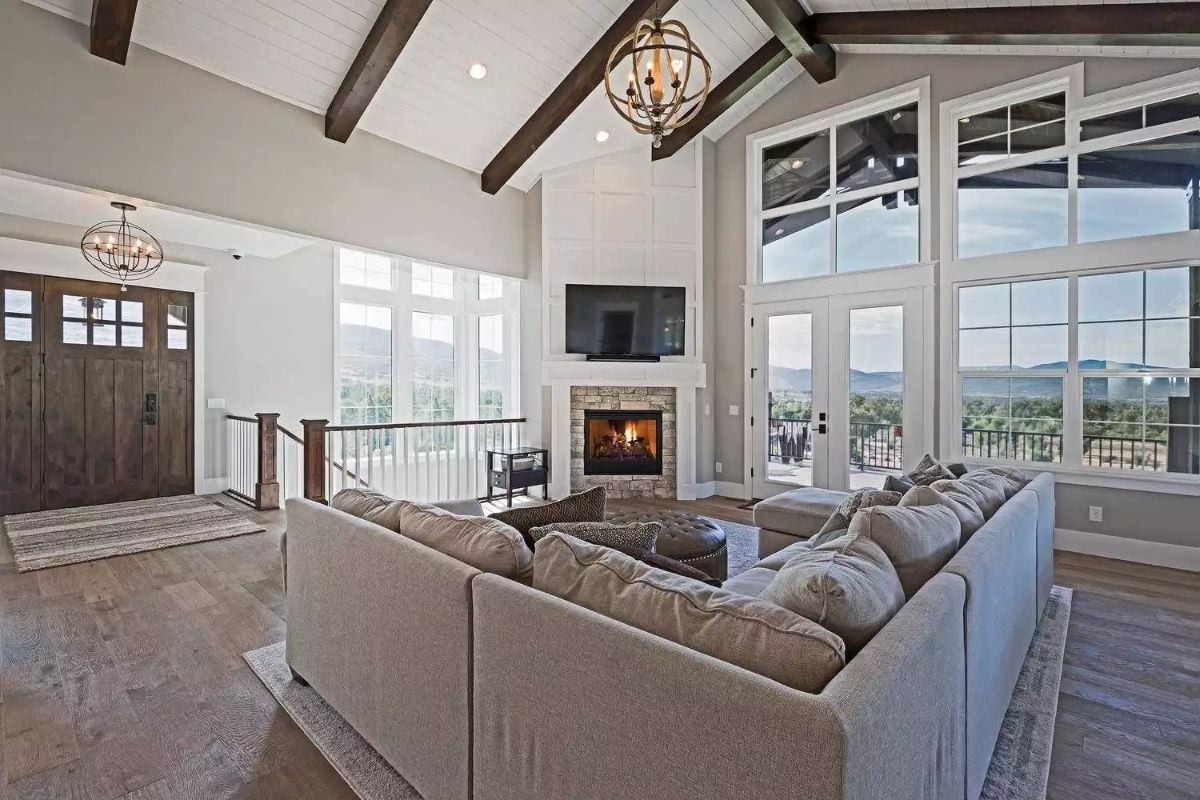 Exposed Beams, Mountain Views, and a Fireplace That Earns Its Wall