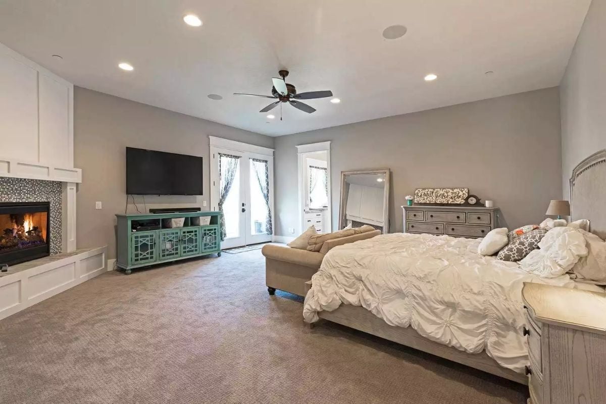 Fireplace on One Wall, French Doors on Another, and a Bed Worth Staying In