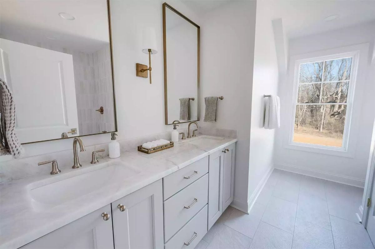 Brushed Brass and Marble Make This Double Vanity Hard to Walk Past