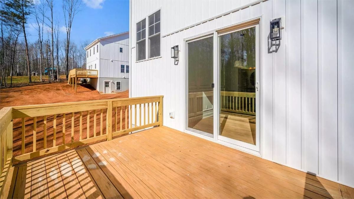 Sliding Glass Doors and Bare Wood Decking Make Backyard Access Feel Effortless