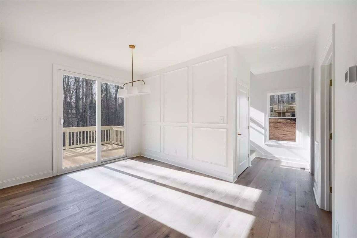 Wainscoting Panels and Sliding Glass Doors Pull Double Duty in This Dining Room