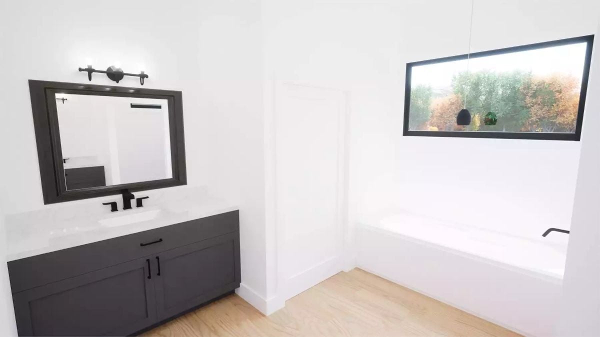 Matte Black Hardware, Soaking Tub, and a Window That Frames the Trees