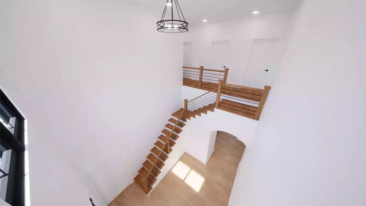 Open Railings, Warm Wood Treads, and a Staircase Built to Be Seen