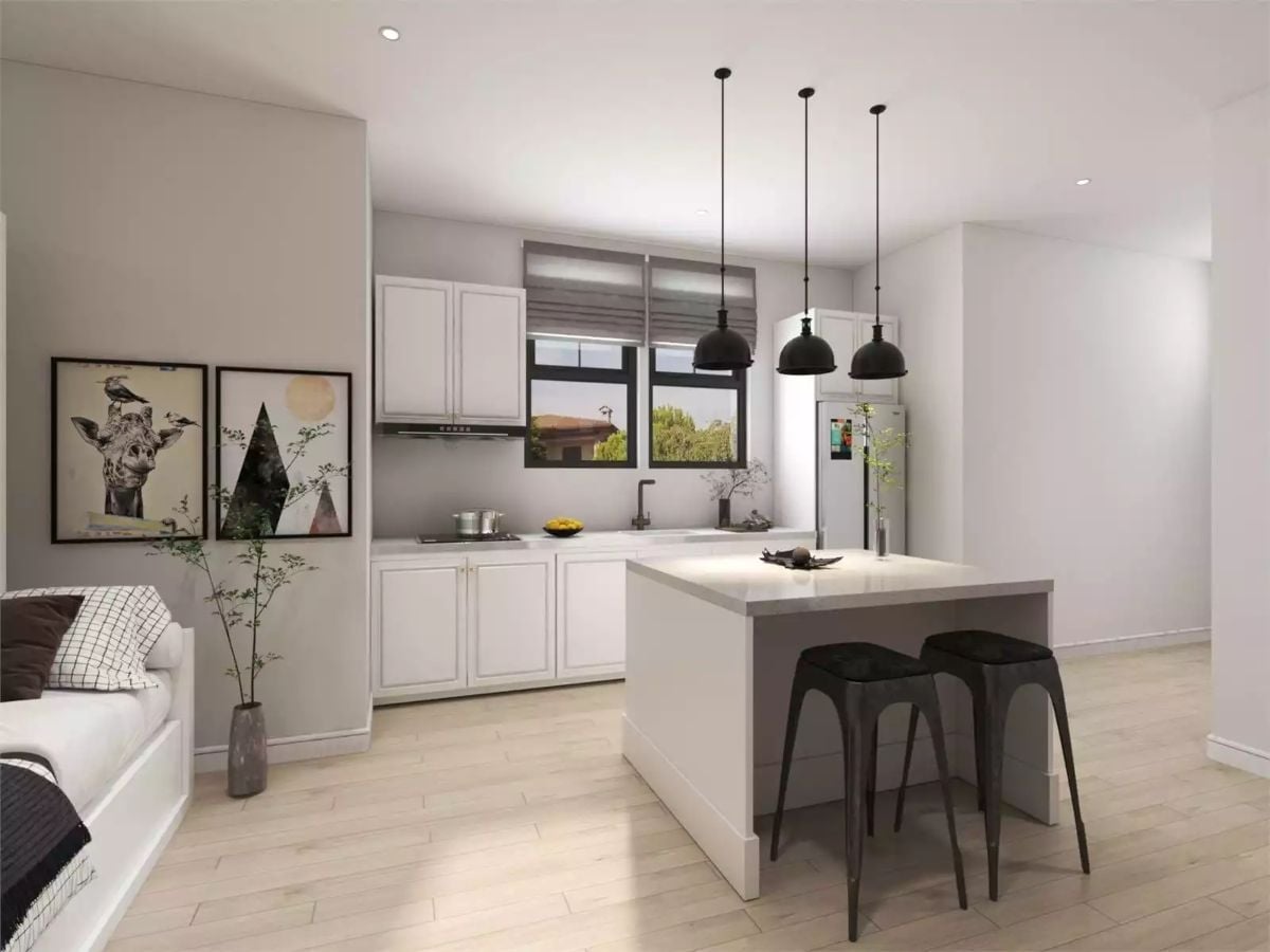 Pendant Lights Earn Their Keep When the Kitchen Has No Upper Cabinets on the Island Side