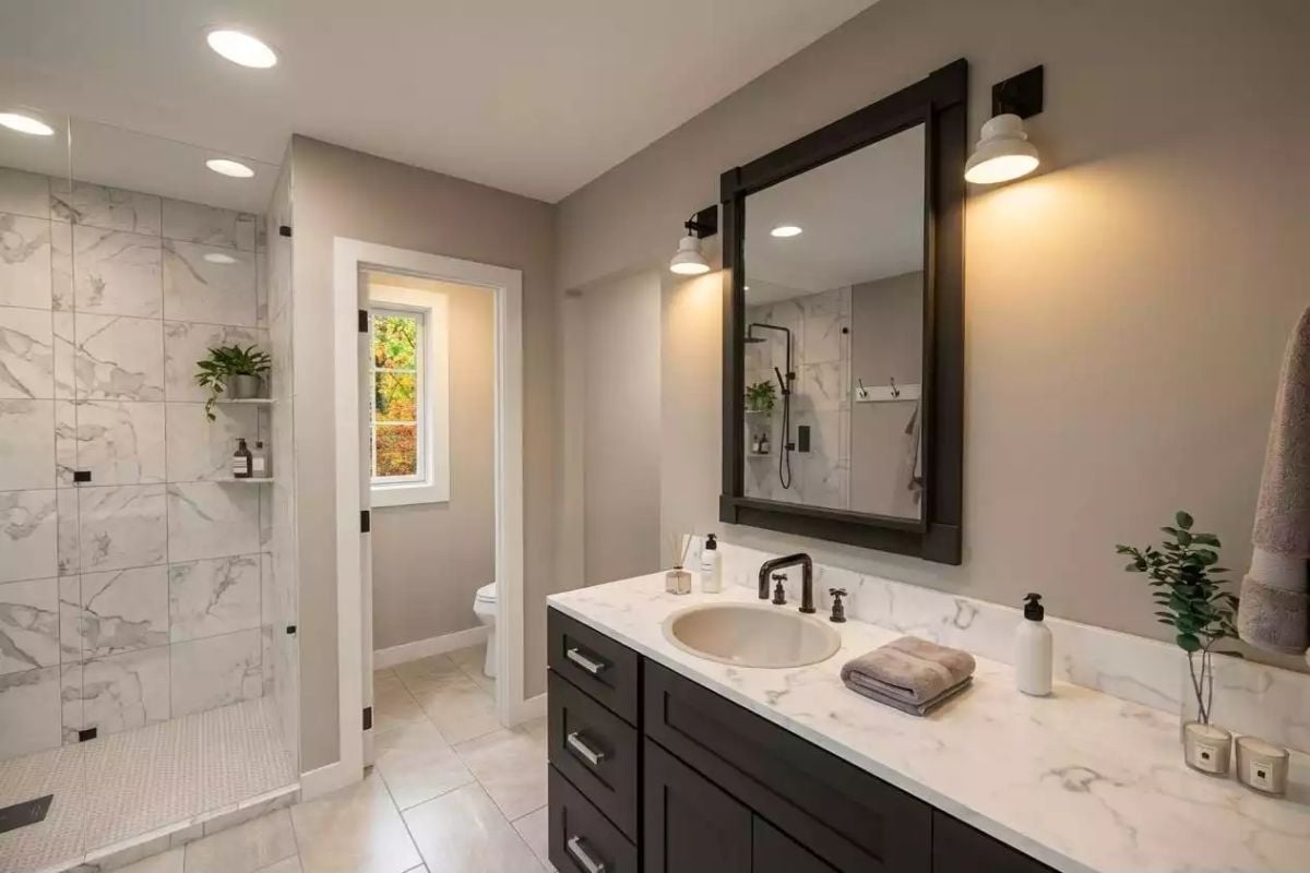 Marble Shower Tile and Matte Black Fixtures Pull This Bathroom Into Focus