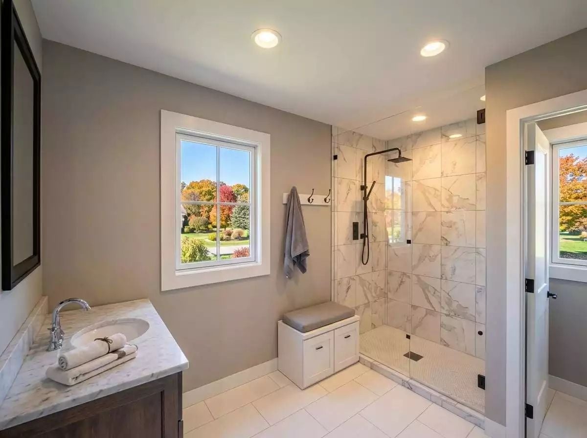 Marble Tile and a Rain Head Turn a Walk-In Shower Into the Reason You Bought the House