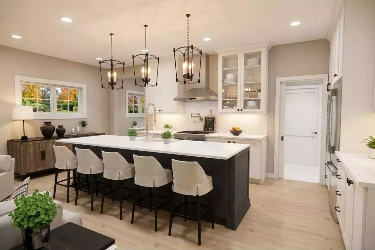 Skirted Barstools and a Black Island Base Earn Their Place in a White Kitchen