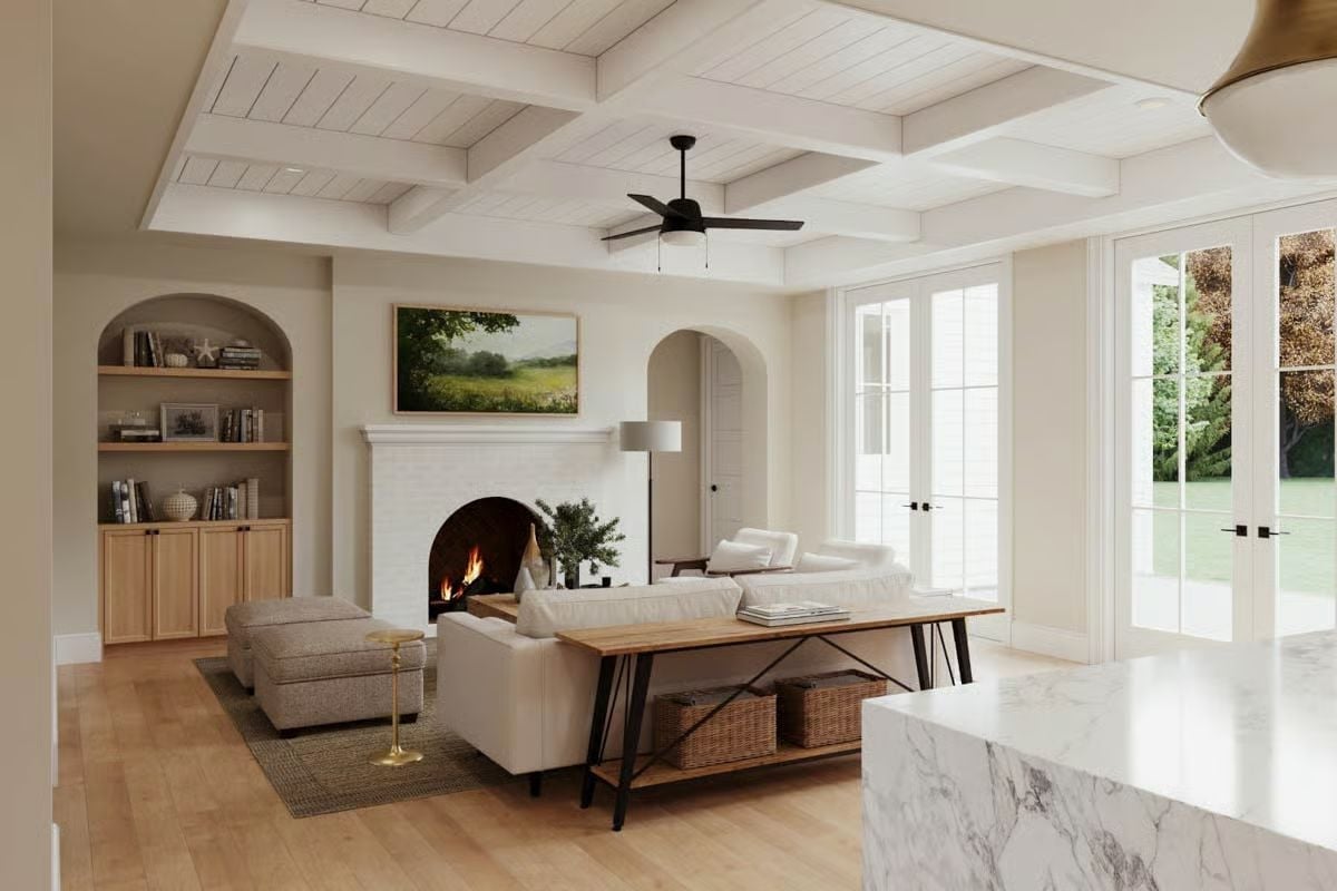 Coffered Ceiling and Arched Built-Ins Ground a Warm, Light-Filled Living Room