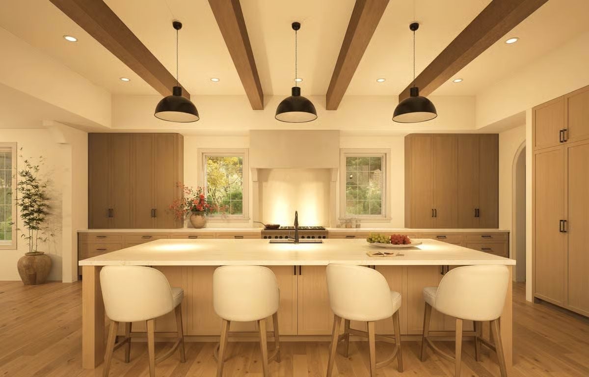 Exposed Ceiling Beams and Black Pendants Pull This Kitchen's Warm Tones Together