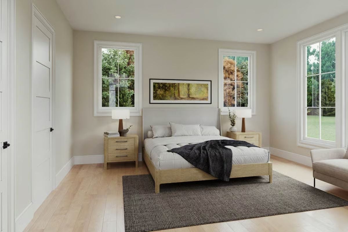 Paired Nightstands and Natural Wood Keep This Bedroom Grounded