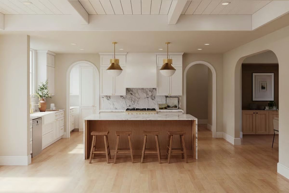 Reeded Island Base and Brass Pendants Set the Tone for This Warm Kitchen