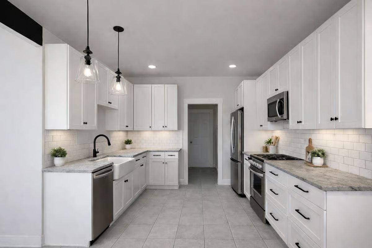White Cabinets and Black Hardware Pull This Kitchen Into Focus