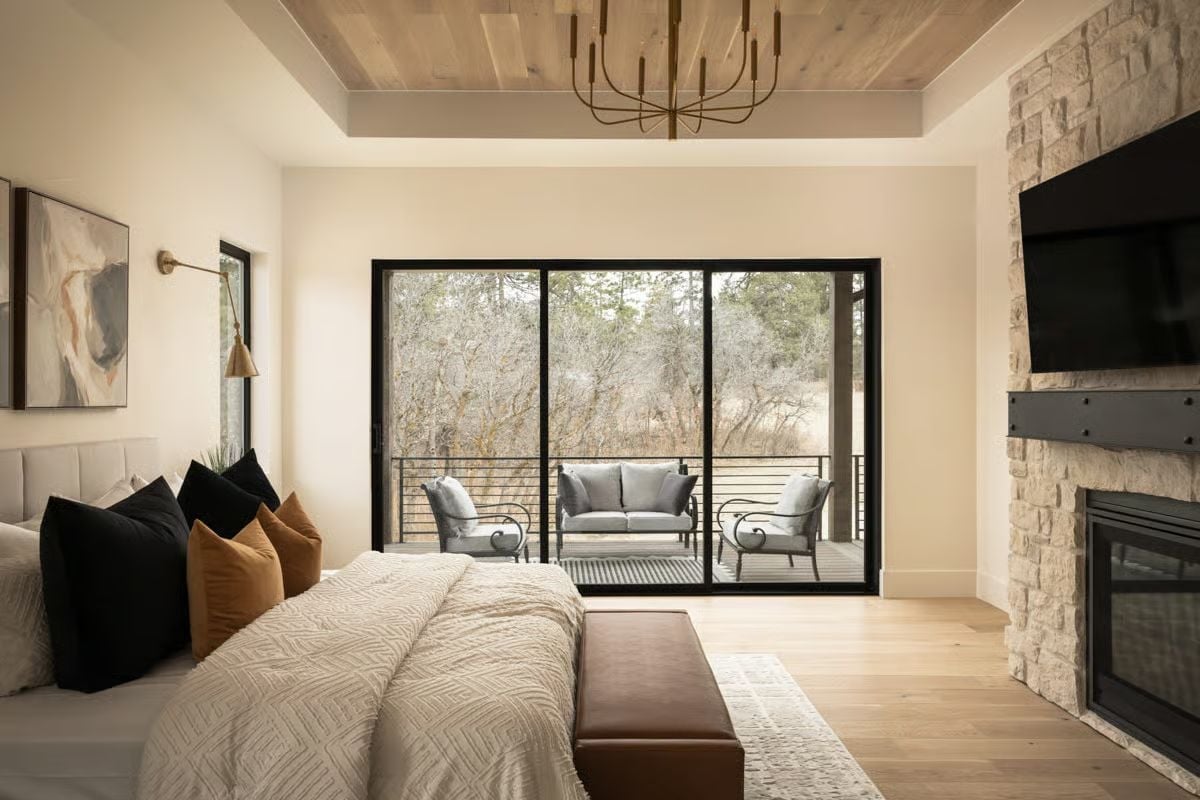 Tray Ceiling, Stone Fireplace, and a Balcony That Earns Its Place