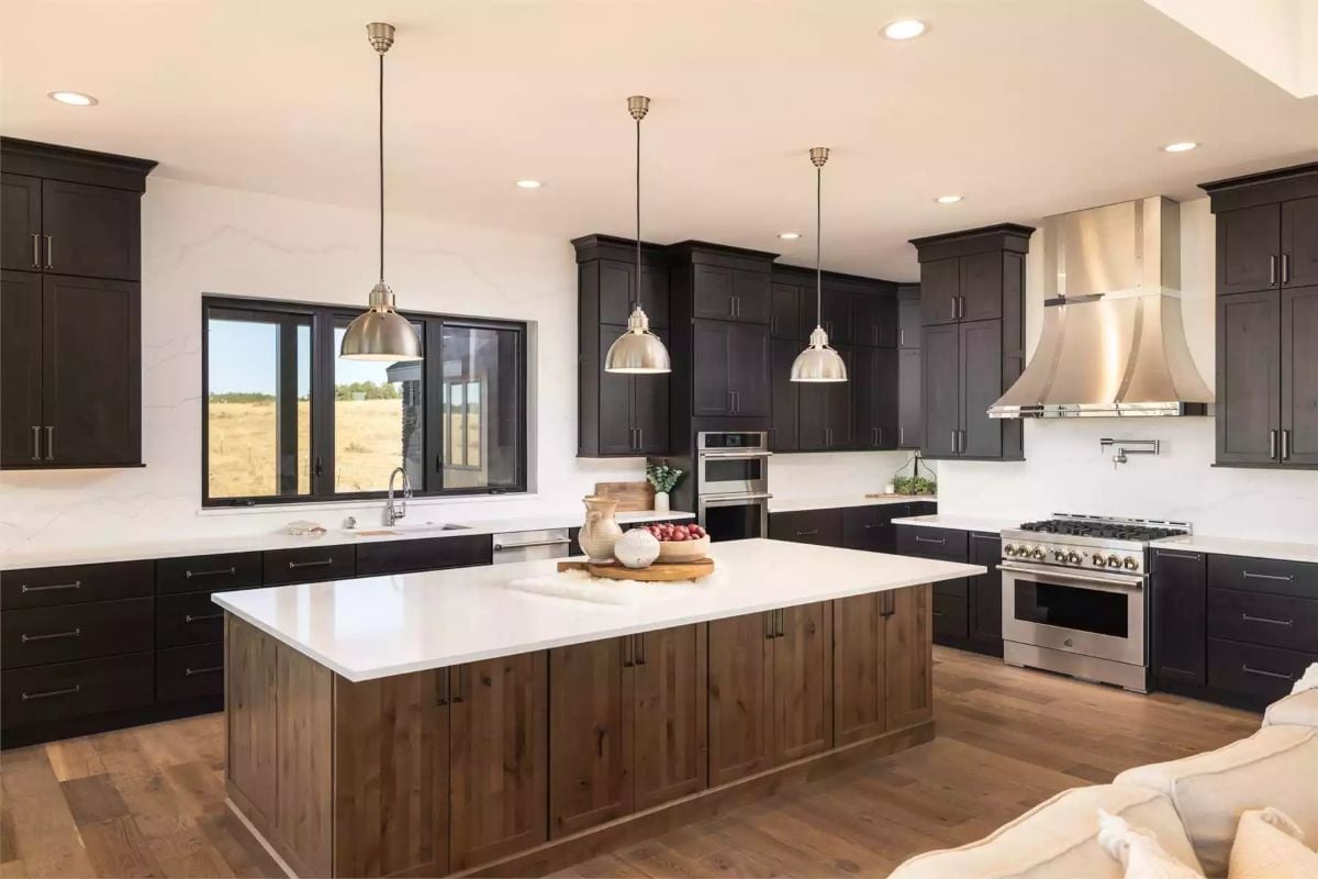 Dark Cabinets, a Wood Island Base, and Three Pendants That Actually Earn Their Keep