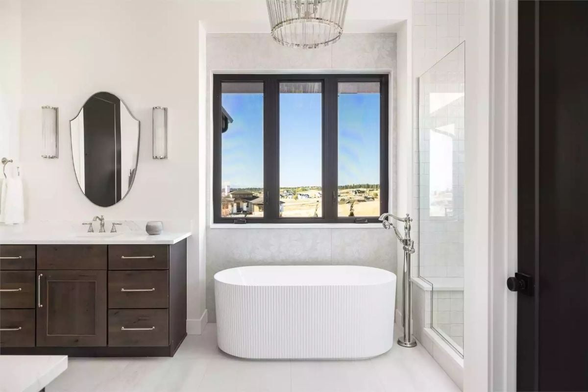Fluted Tub, Black Window Frames, and a Freestanding Faucet That Steals the Room