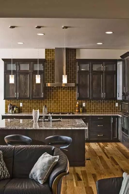 Olive Tile and Dark Cabinets Doing the Heavy Lifting Back There