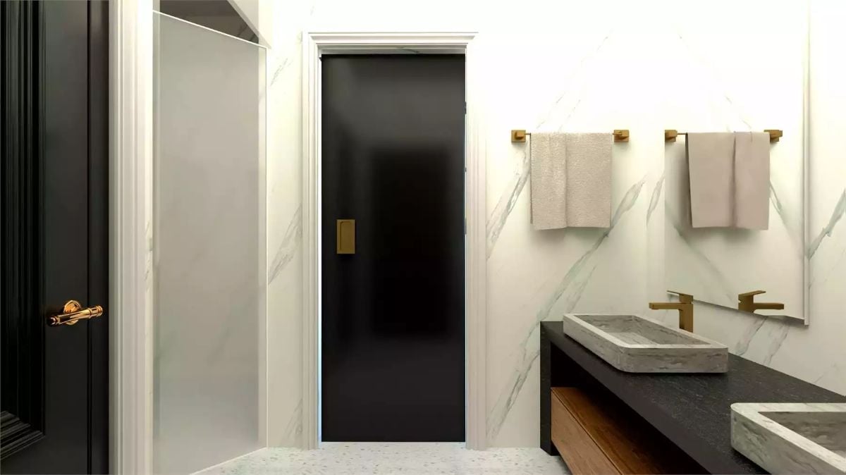 Black Pocket Door, Stone Sinks, and Gold Hardware That Pulls It All Together