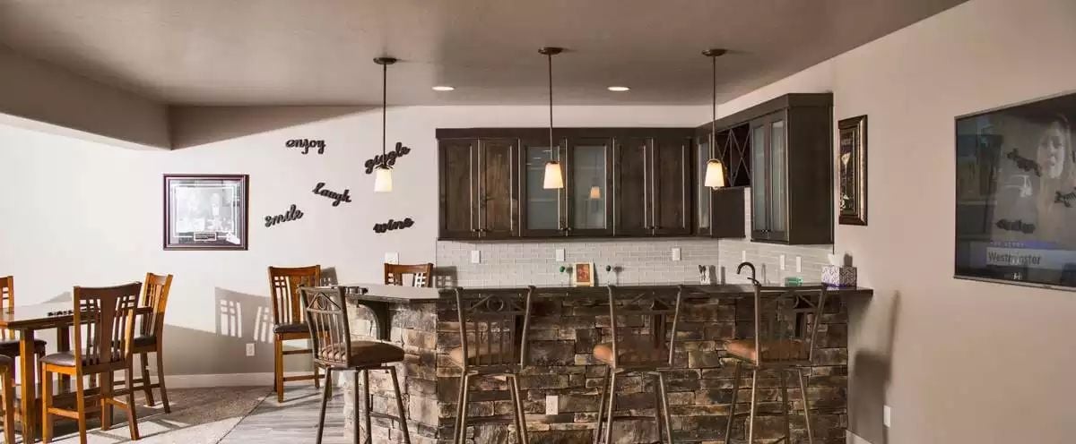 Stacked Stone Bar Front That Means Business in the Basement