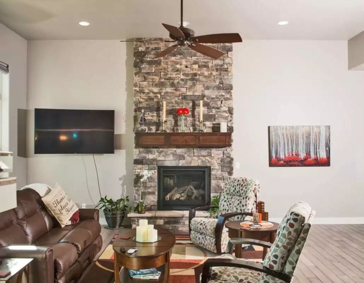 Stone Fireplace Tower That Earns Every Inch of Ceiling Height