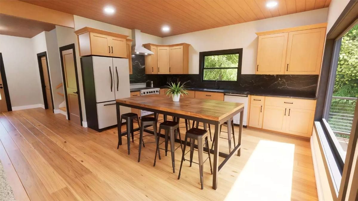Black Marble Backsplash Against Honey Maple Cabinets Is a Pairing Worth Stealing