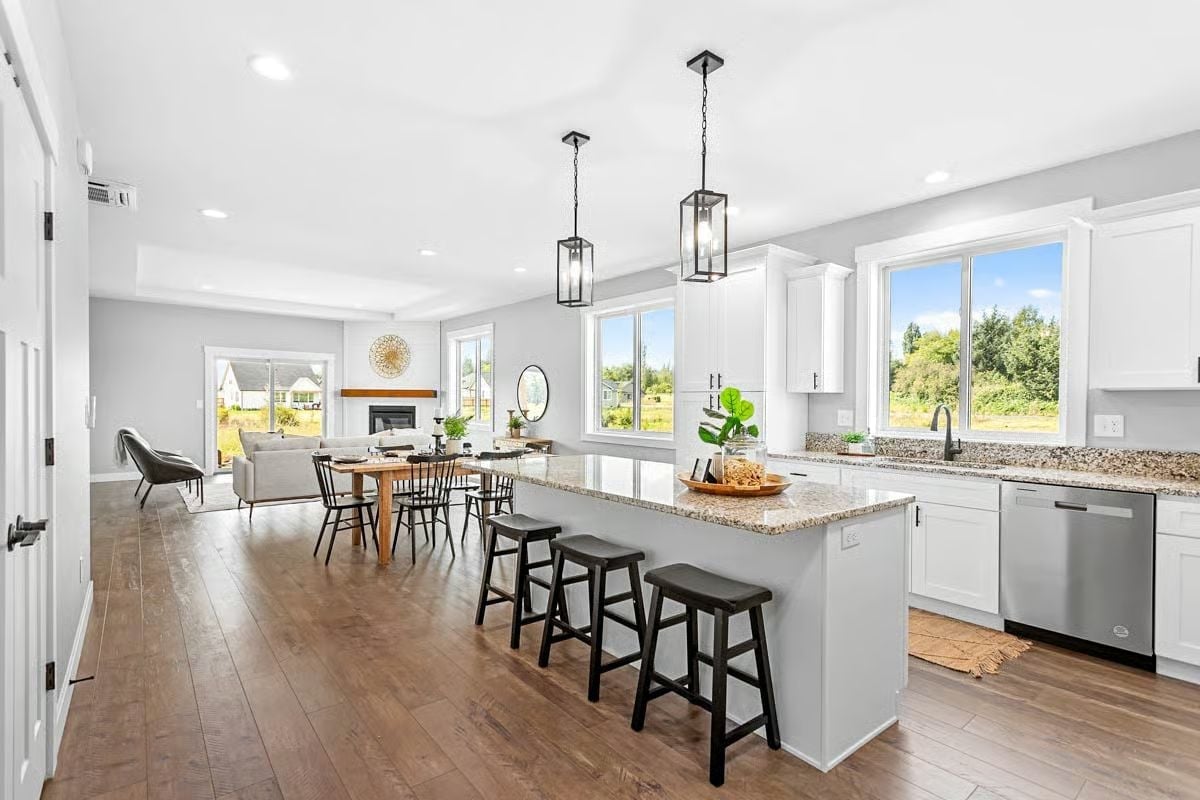 Granite, Black Stools, and an Island Long Enough to Mean It