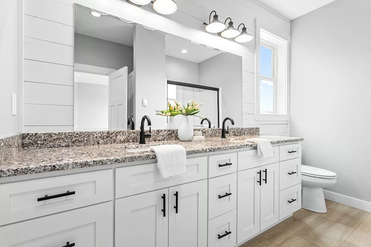 Matte Black Hardware Against Granite That Earns Every Inch of Counter Space