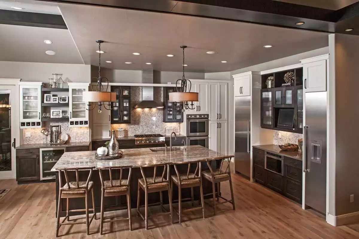 Dark Cabinetry and Granite Pull This Kitchen Far From Builder-Grade