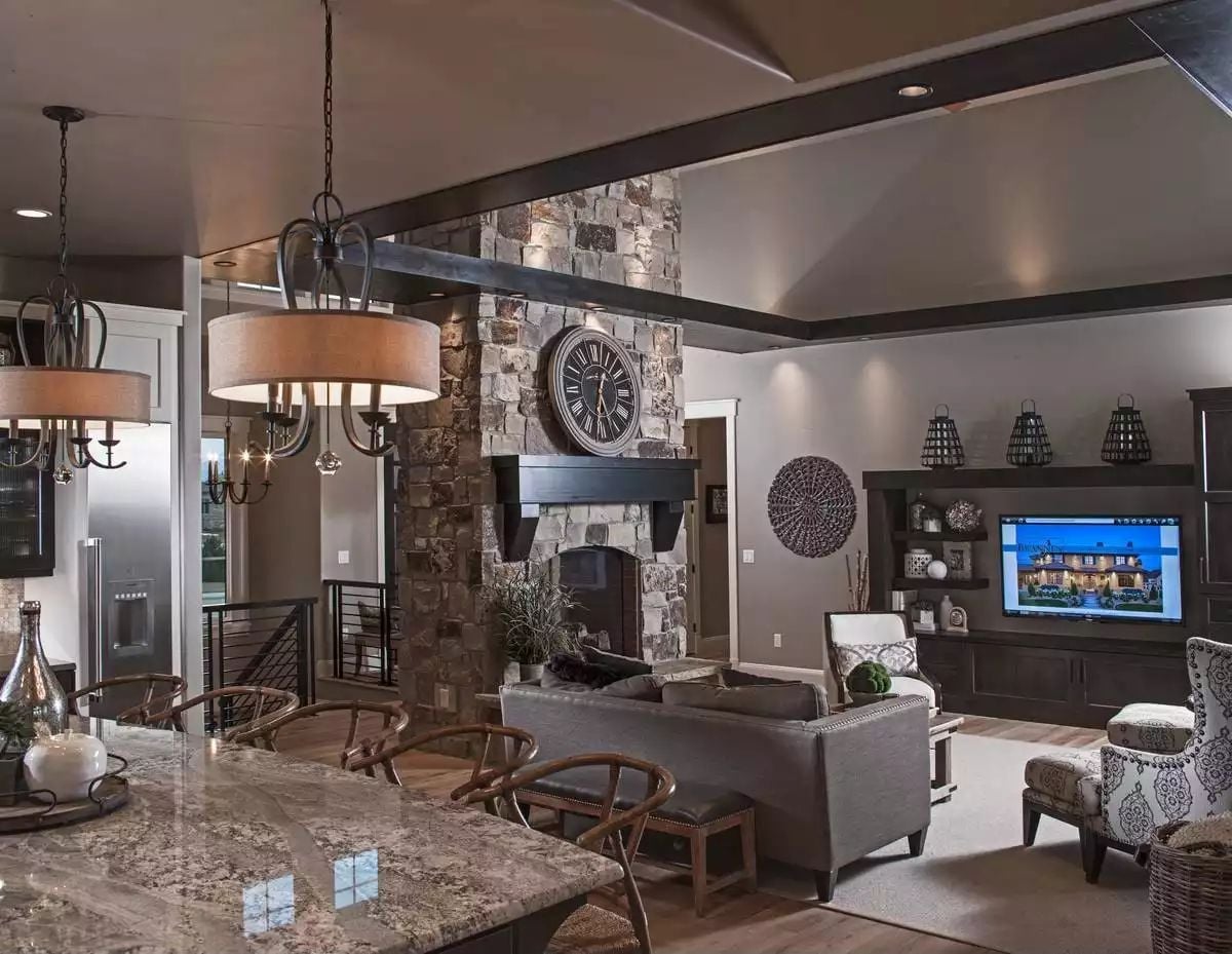 Stone Fireplace Tower and Exposed Beams Do the Heavy Lifting Here