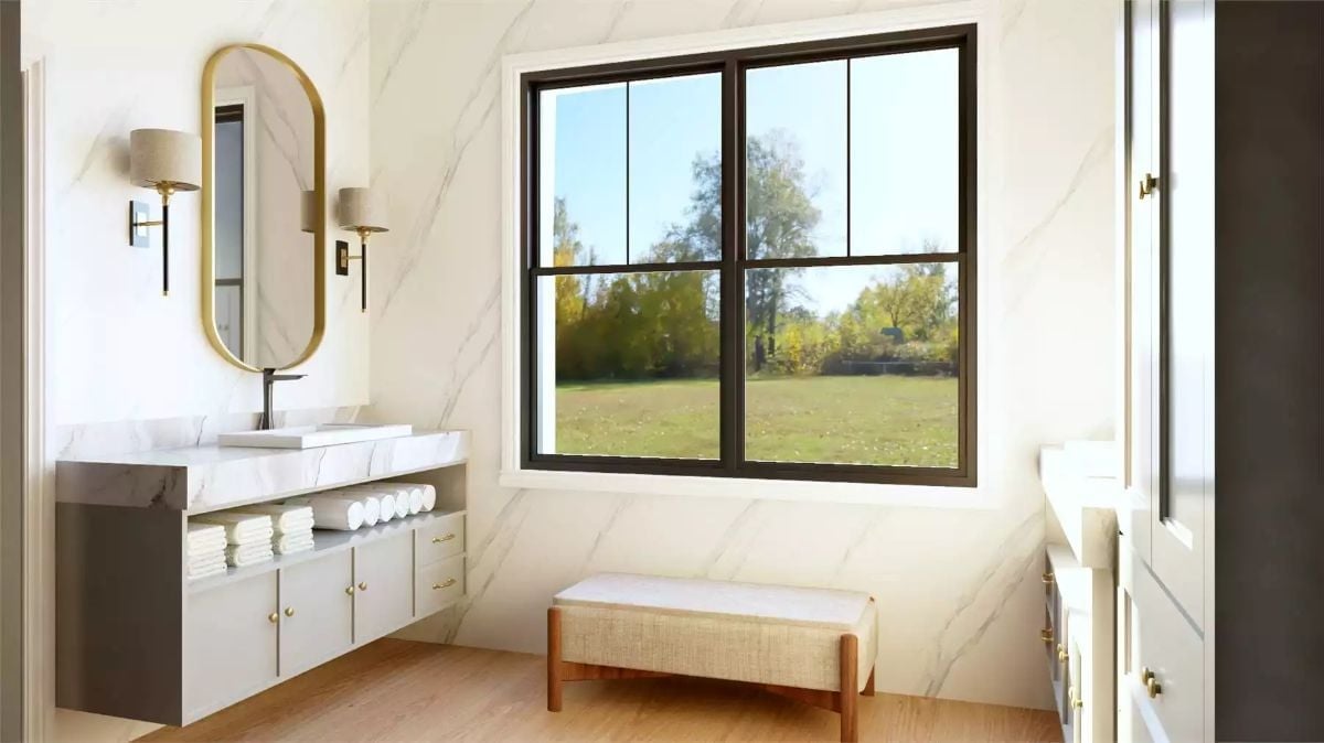 Oval Mirror and Floating Vanity Give This Bathroom Its Sense of Proportion