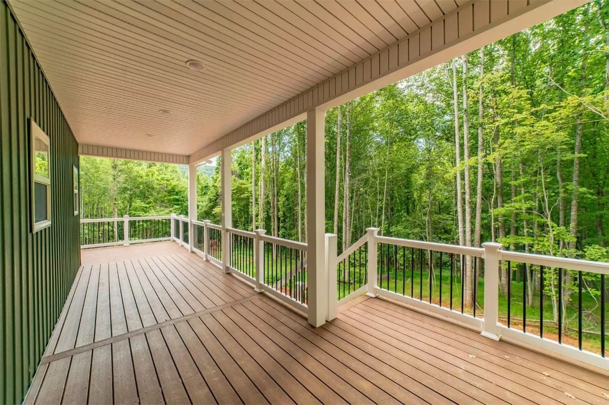 Covered Deck Overlooking a Tree Line That Does All the Decorating For You