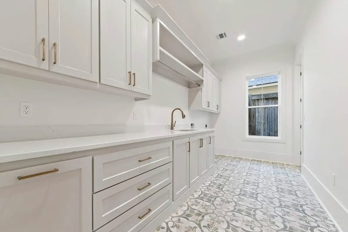 Patterned Cement Tile Earns Its Keep in a Laundry Room Built for Real Use