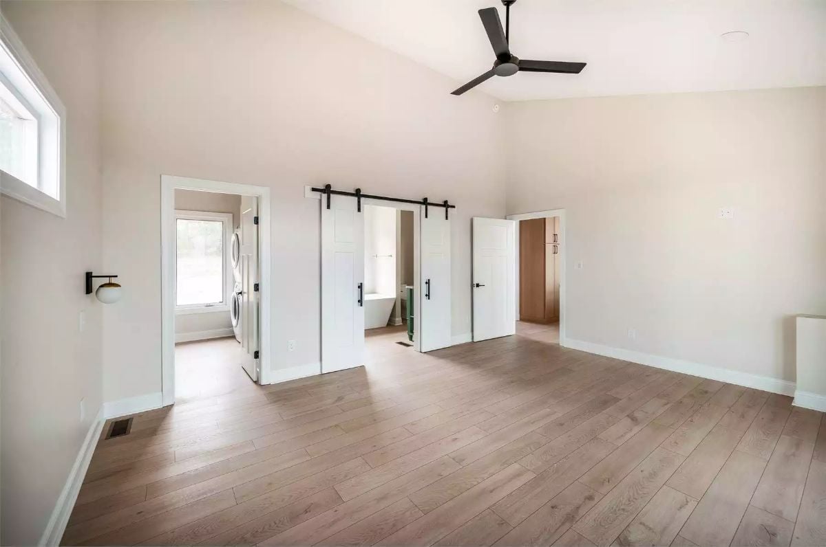 Barn Doors, Vaulted Ceilings, and a Soaking Tub Hiding in Plain Sight