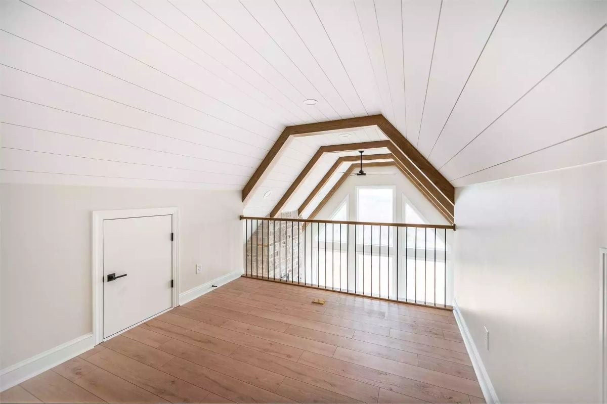 Shiplap Ceiling, Exposed Beams, and a Loft Rail That Opens Everything Up