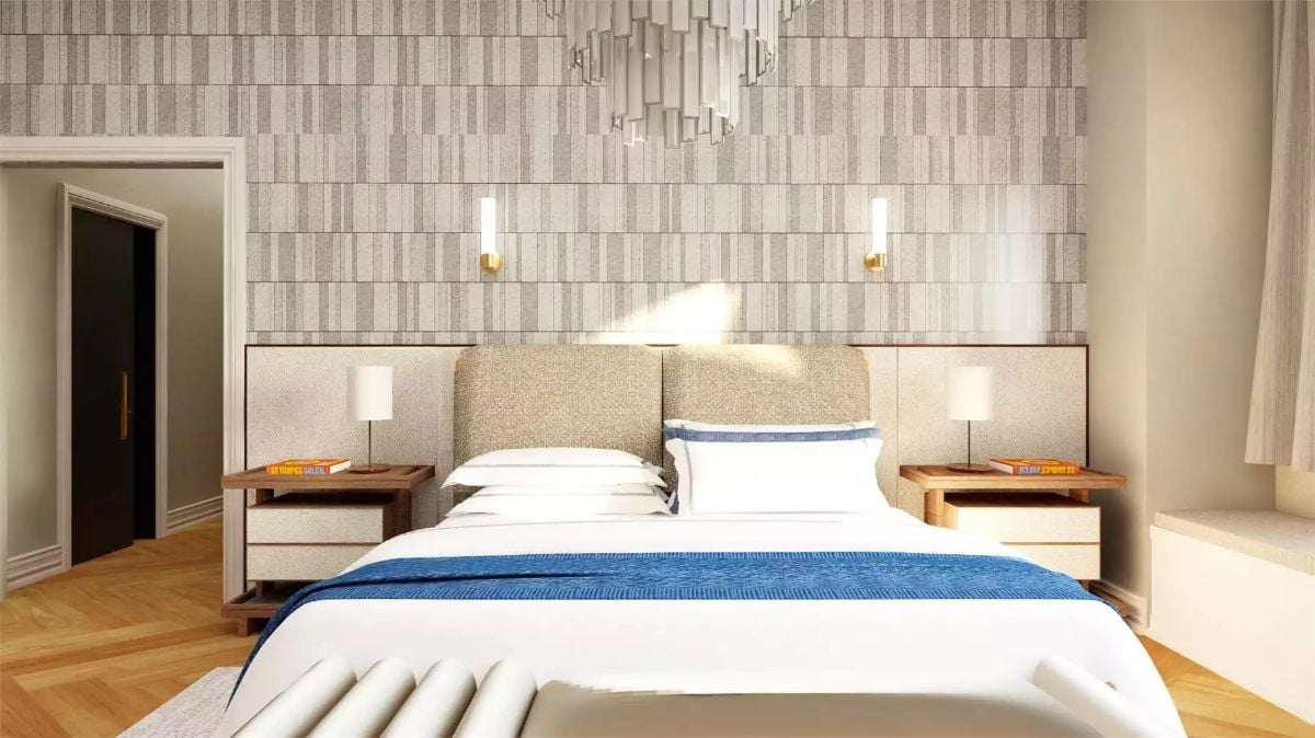 Gold Sconces and a Herringbone Floor Give This Hotel-Style Bedroom Real Staying Power