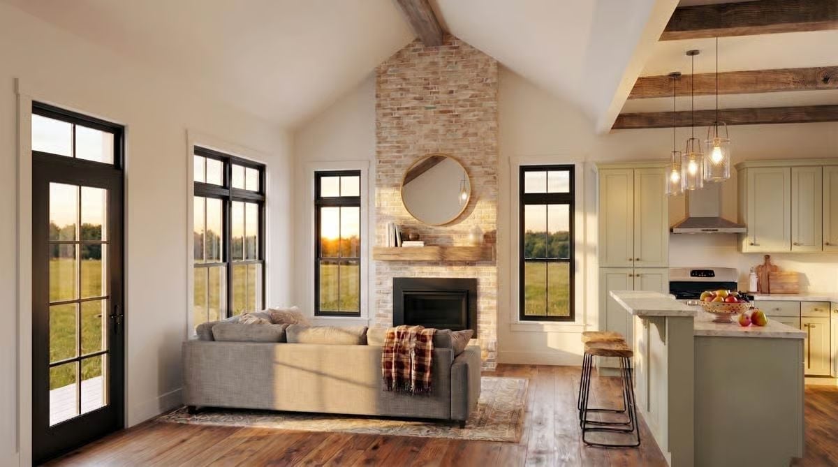 Vaulted Ceilings and a Brick Chimney Anchor the Living Space Without Competing With the View