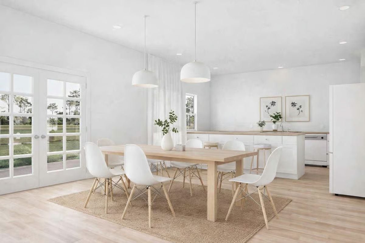 Eames Chairs, French Doors, and a Kitchen That Stays Out of the Way